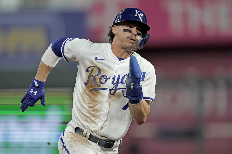 Kansas City Royals' Bobby Witt Jr. runs home to score on a double by Salvador Perez second after hitting an RBI double during the first inning of a baseball game against the Minnesota Twins Wednesday, Sept. 21, 2022, in Kansas City, Mo. (AP Photo/Charlie Riedel)