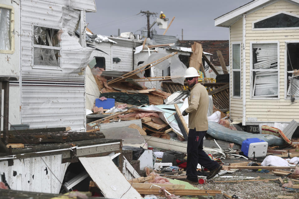 Power company lineman work to restore power after a tornado hit Emerald Isle N.C. as Hurricane Dorian moved up the East coast on Thursday, Sept. 5, 2019.  (Photo/Tom Copeland/AP)