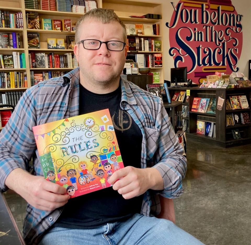 Savannah author Jeffrey Pax holds his children's book "The Rules" at The Stacks Bookstore, 2409 Waters Ave.