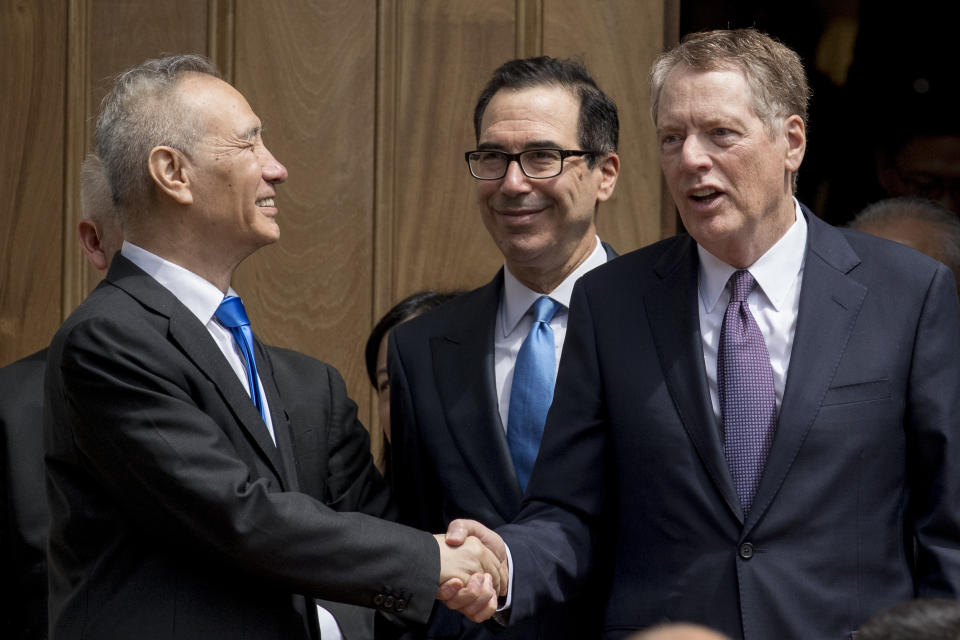 Treasury Secretary Steve Mnuchin, center, and United States Trade Representative Robert Lighthizer, right, speak with Chinese Vice Premier Liu He, left, as he departs the Office of the United States Trade Representative in Washington, Friday, May 10, 2019. (AP Photo/Andrew Harnik)