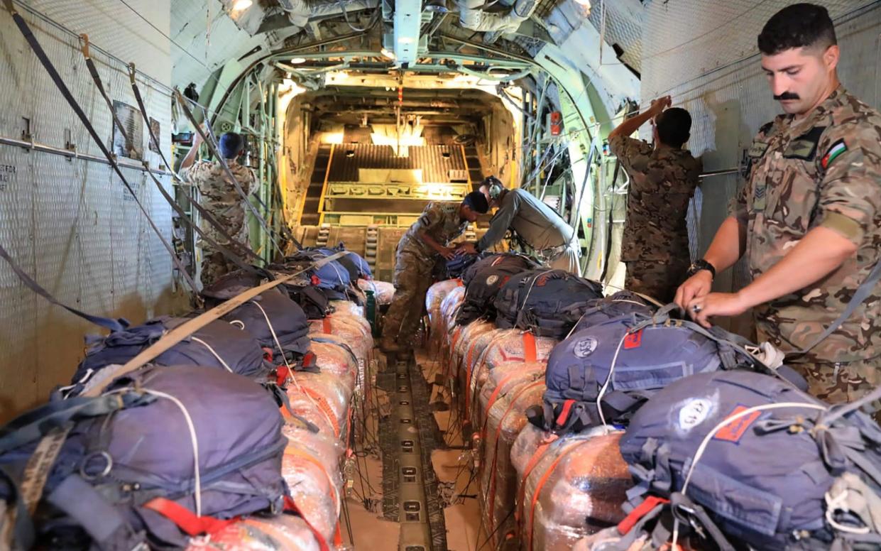 Humanitarian aid being loaded onto a military aircraft for an airdrop over the Gaza Strip