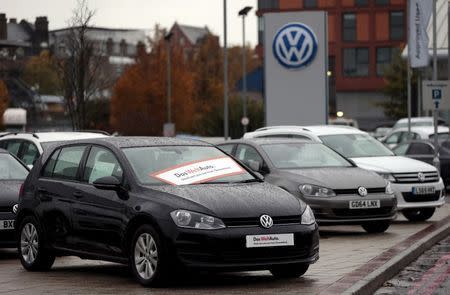 Volkswagen cars are seen parked outside a VW dealership in London in this November 5, 2015 file photograph. REUTERS/Suzanne Plunkett