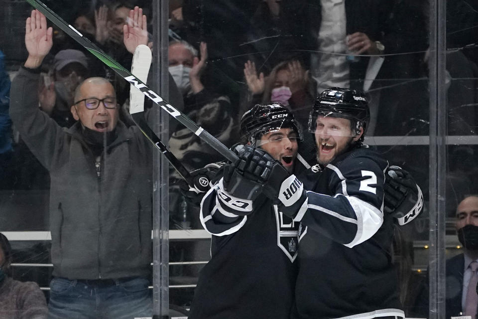 Los Angeles Kings defenseman Alexander Edler, right, celebrates his goal with right wing Alex Iafallo during the second period of an NHL hockey game against the Calgary Flames Thursday, Dec. 2, 2021, in Los Angeles. (AP Photo/Mark J. Terrill)