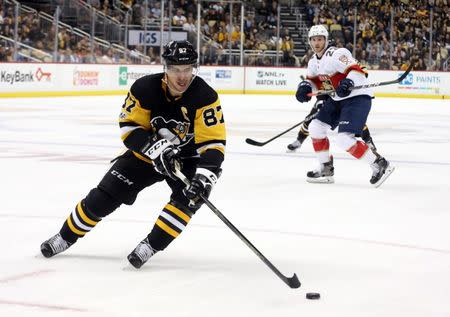 Oct 14, 2017; Pittsburgh, PA, USA; Pittsburgh Penguins center Sidney Crosby (87) skates after the puck against the Florida Panthers during the third period at PPG PAINTS Arena. The Penguins won 4-3. Mandatory Credit: Charles LeClaire-USA TODAY Sports