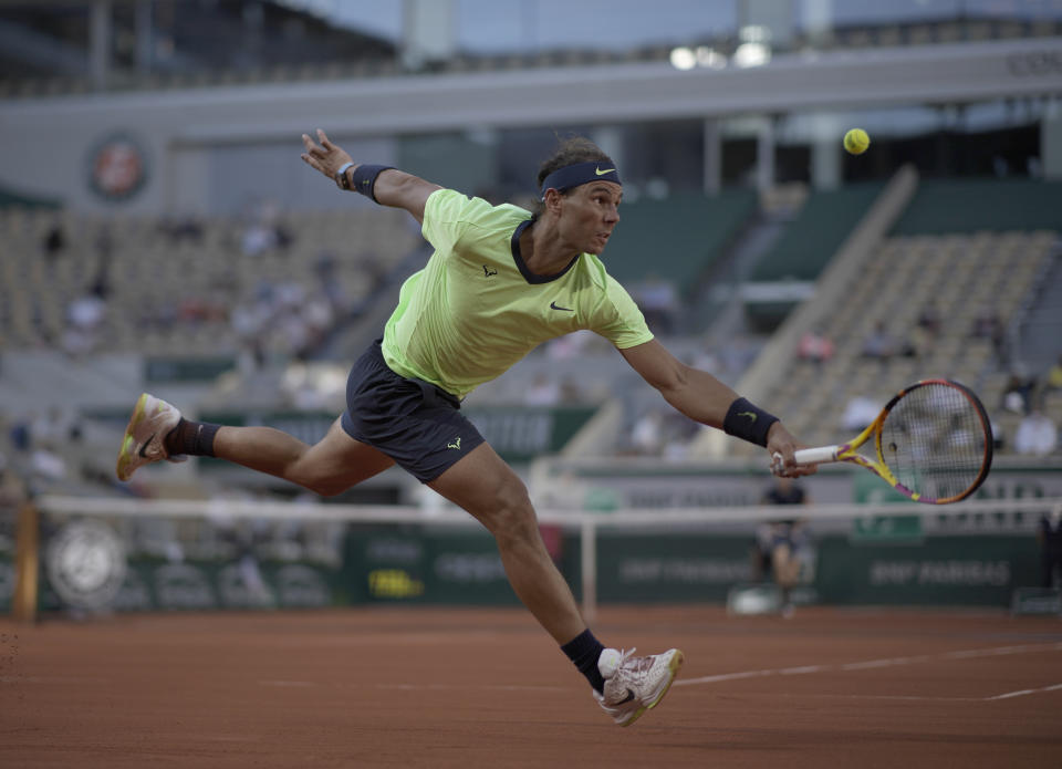 Spain's Rafael Nadal plays a return to Italy's Jannik Sinner during their fourth round match on day 9, of the French Open tennis tournament at Roland Garros in Paris, France, Monday, June 7, 2021.(AP Photo/Christophe Ena)