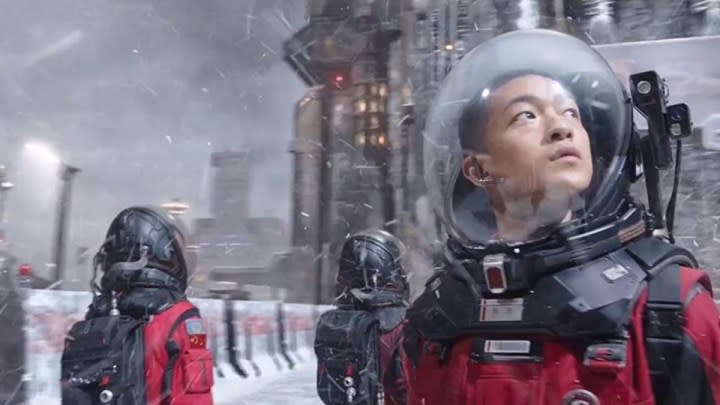 A young man standing in a frozen tundra in "The Wandering Earth."