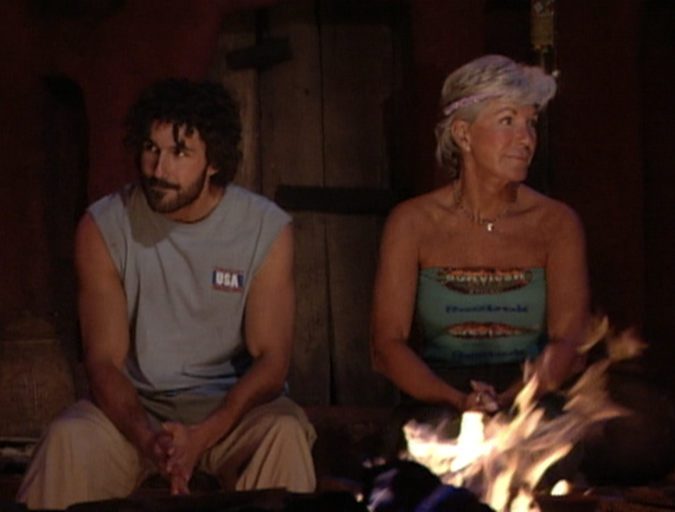 Ethan Zohn and Kim Johnson sit together at the finale of Survivor: Africa