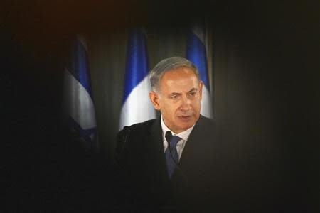 Israel Prime Minister Benjamin Netanyahu speaks during a joint news conference with French President Francois Hollande (not pictured) at his residence in Jerusalem November 17, 2013. REUTERS/Alain Jocard/Pool