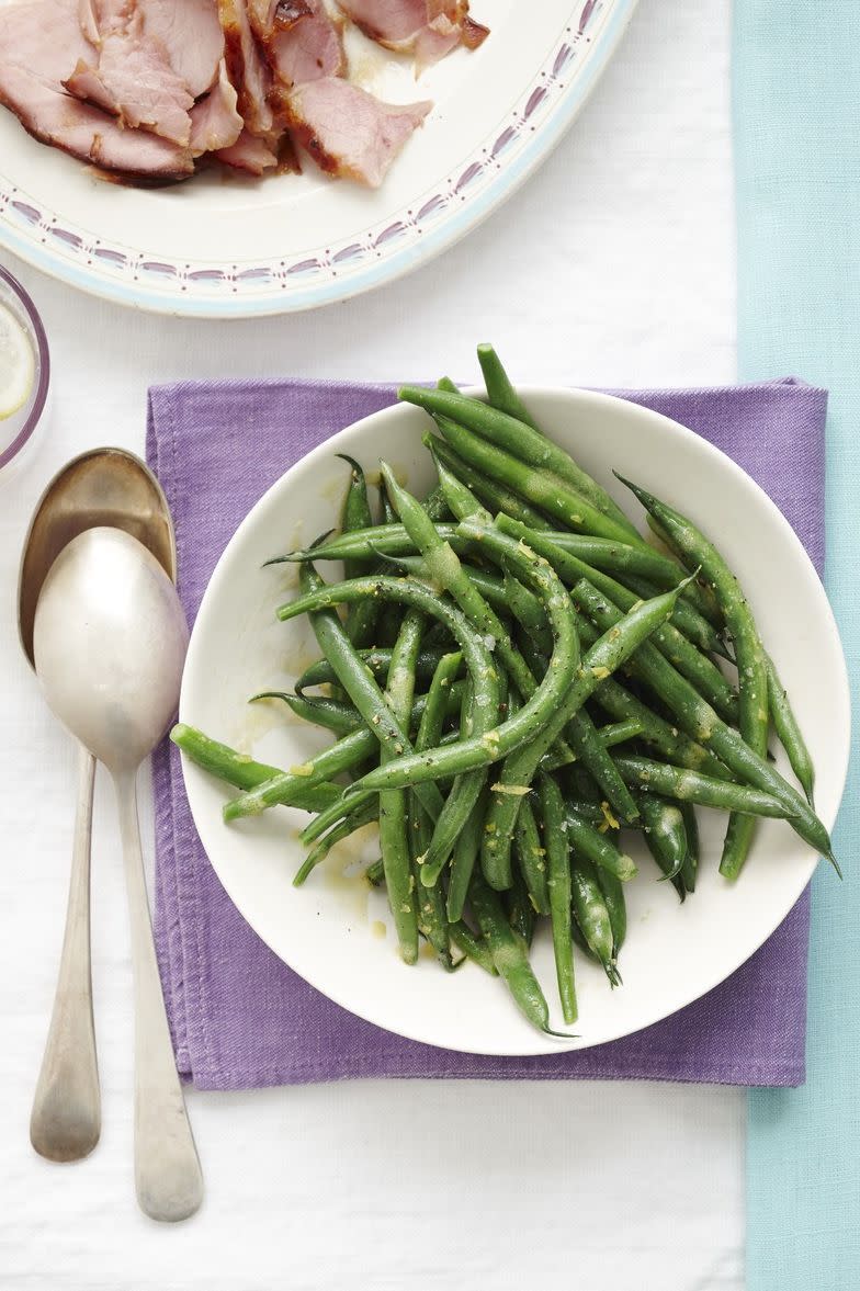 <p>A refreshing lemon vinaigrette helps lighten any heavy meal (plus, it makes green beans taste delicious). </p><p>Get the <strong><a href="https://www.womansday.com/food-recipes/food-drinks/recipes/a12328/green-beans-lemon-vinaigrette-recipe-wdy0414/" rel="nofollow noopener" target="_blank" data-ylk="slk:Green Beans with Lemon Vinaigrette recipe;elm:context_link;itc:0;sec:content-canvas" class="link ">Green Beans with Lemon Vinaigrette recipe</a></strong>.</p>