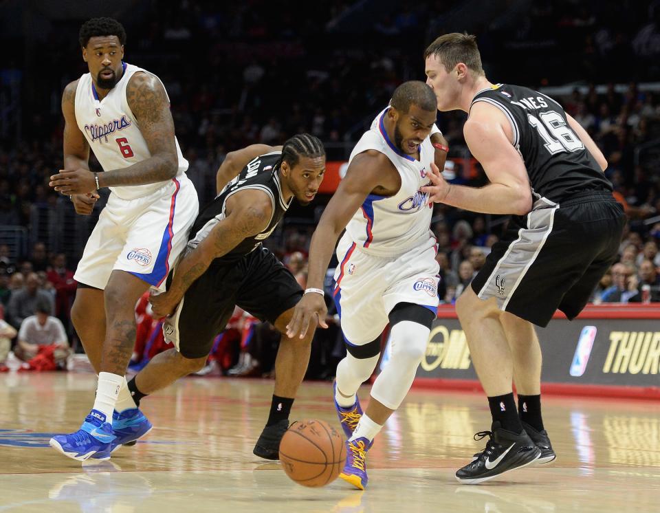 Chris Paul escapes Kawhi Leonard's clutches. (Harry How/Getty Images)