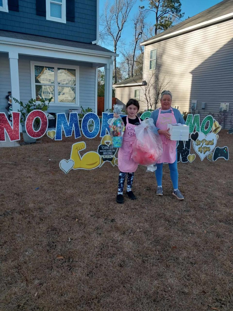 The Oak Island Angels don't just work at Christmas. They respond at other times of the year, too. Here they take gifts and treats to an Oak Island resident who has just completed chemotherapy treatments.