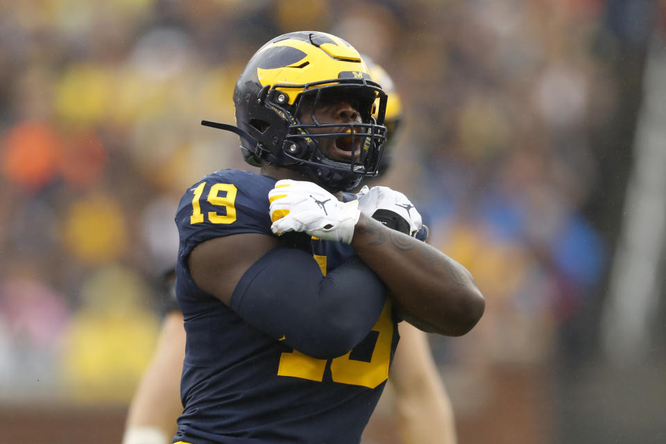 Michigan defensive lineman Kwity Paye reacts after sacking Rutgers quarterback Artur Sitkowski in the first half of an NCAA college football game in Ann Arbor, Mich., Saturday, Sept. 28, 2019. (AP Photo/Paul Sancya)