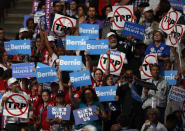 <p>Bernie Sander supporters hold signs during the first day of the Democratic National Convention in Philadelphia, July 25, 2016. (AP Photo/Paul Sancya)</p>