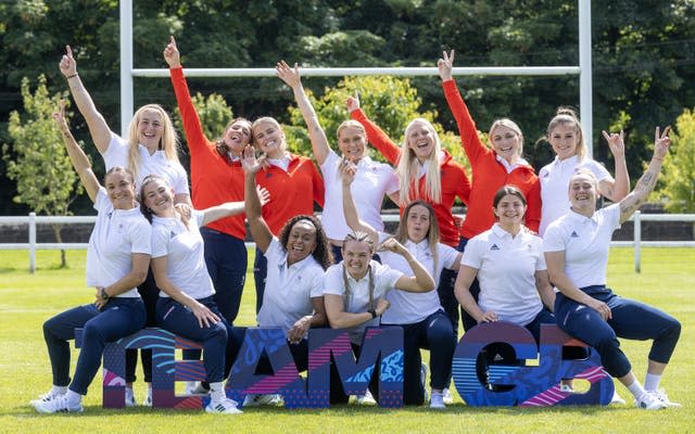 Team GB's rugby sevens squad for Paris 2024 raise their arms in the air to celebrate