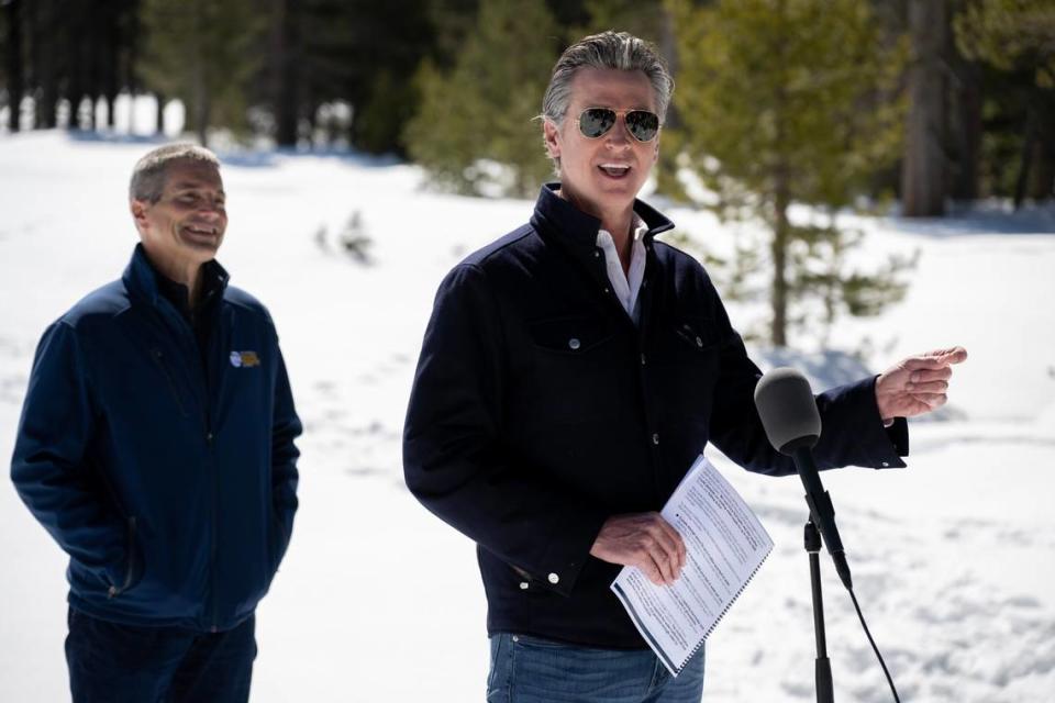 Gov. Gavin Newsom announces the new California Water Plan with California Natural Resources Secretary Wade Crowfoot during the April snow survey at Phillips Station in El Dorado County on Tuesday, April 2, 2024. The measurement of the April water content in the snowpack is 110% of normal and is a key indicator for future water supply.