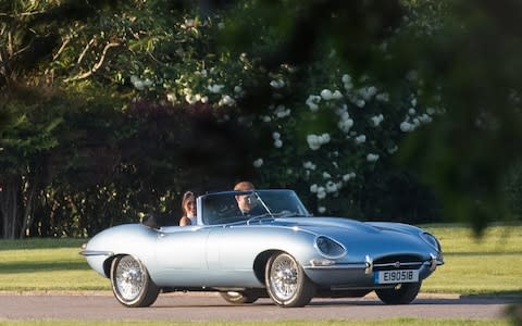 The Duke and Duchess made their way to the Frogmore House reception in a vintage Jaguar E-Type Concept Zero - Credit: Samir Hussein