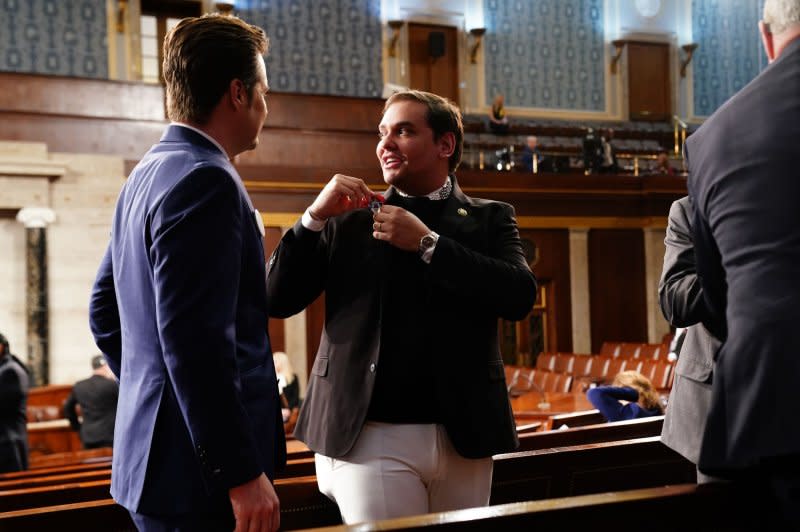 Rep. Matt Gaetz, R-Fla. (L), and expelled former Rep. George Santos, R-N.Y., talk as they wait for President Joe Biden to deliver the annual State of the Union speech to a joint session of Congress at the U.S. Capitol in Washington, D.C., on Thursday. Pool Photo by Shawn Thew/UPI