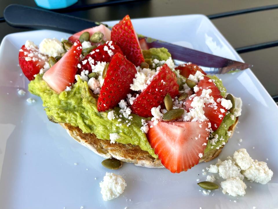 "The Mate" from Cafe You in Cape Coral is an avocado toast finished with strawberries, feta and pumpkin seeds.