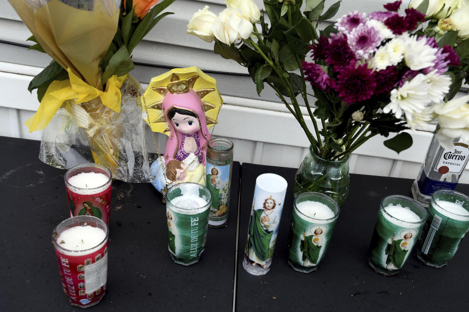 A memorial is seen on Monday, May 10, 2021, outside a mobile home in Colorado Springs, Colo., where a shooting at a party took place a day earlier that killed six people before the gunman took his own life. (AP Photo/Thomas Peipert)