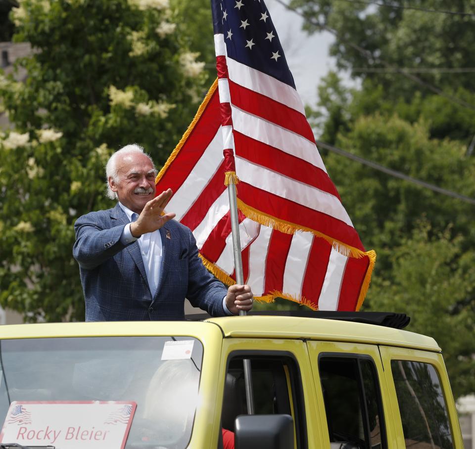 Parade Marshall Rocky Bleier waves to the crowd during the 72nd Appleton Flag Day Parade on Saturday, June 10, 2023, in Appleton, Wis.