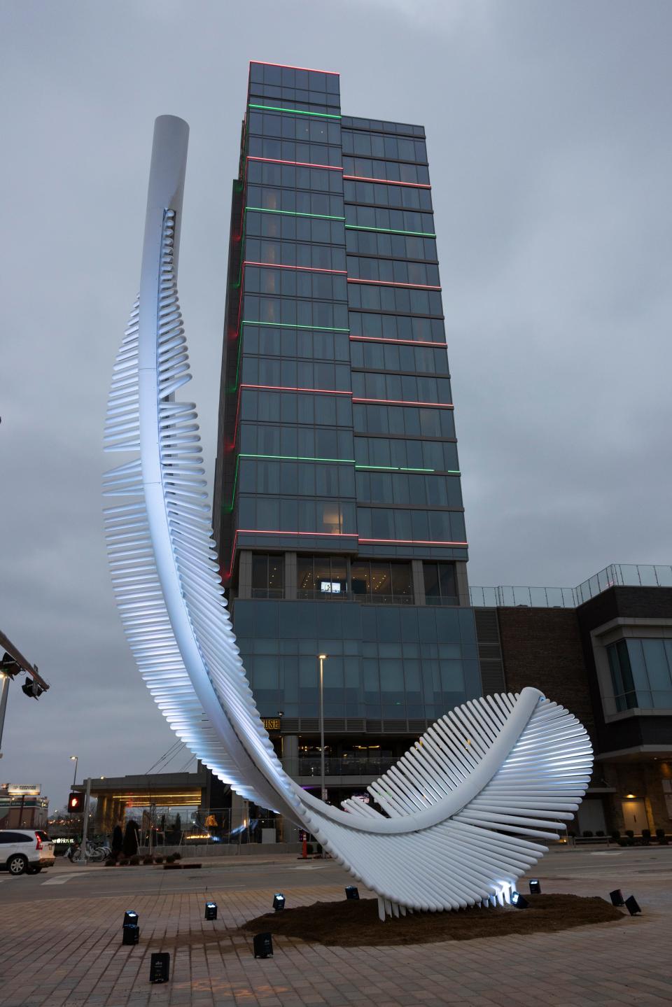 The new "Light as a Feather" sculpture, dedicated to late  city arts liaison Robbie Kienzle, is lit Wednesday, Dec. 21, 2022, at Scissortail Park. in Oklahoma City.