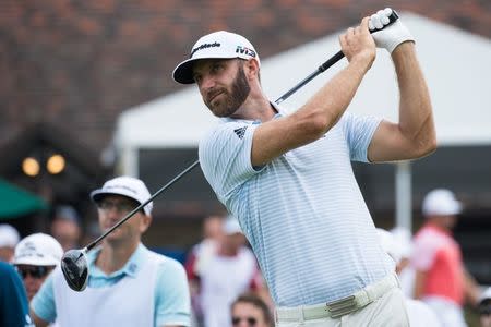 FILE PHOTO: Sep 7, 2018; Newtown Square, PA, USA; Dustin Johnson plays his shot from the tenth tee during the second round of the BMW Championship golf tournament at Aronimink GC. Mandatory Credit: Bill Streicher-USA TODAY Sports/File Photo