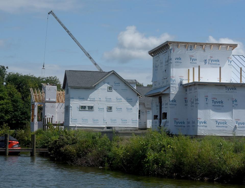 Three homes being built next to each other along Buckeye Lake.