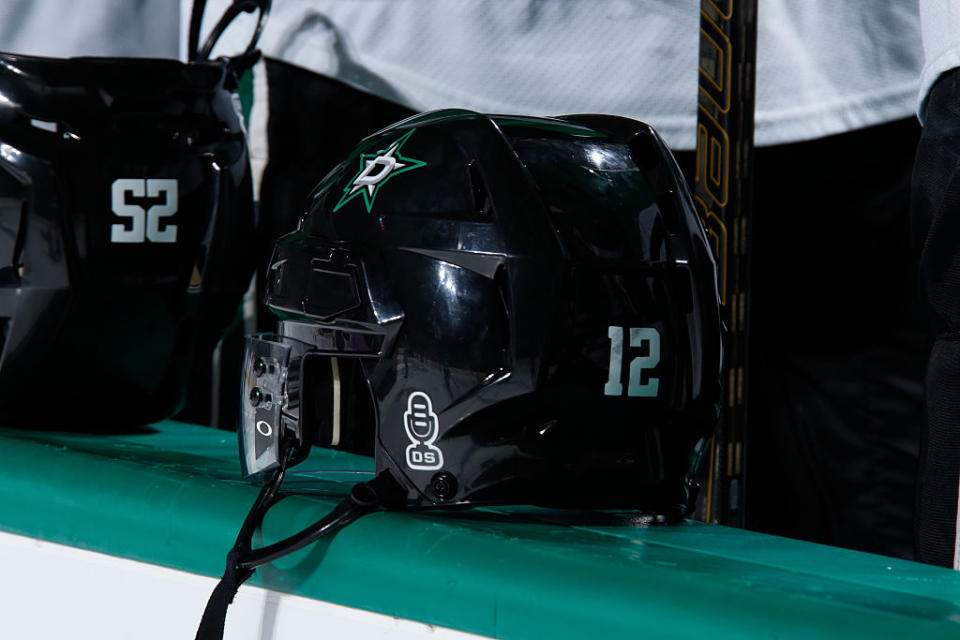 DALLAS, TX – OCTOBER 22: Special stickers are worn on the back of the Dallas Stars helmets to honor Dallas Stars play-by-play announcer Dave Strader who is currently locked in a battle with cancer before a game against the Columbus Blue Jackets at the American Airlines Center on October 22, 2016 in Dallas, Texas. (Photo by Glenn James/NHLI via Getty Images)