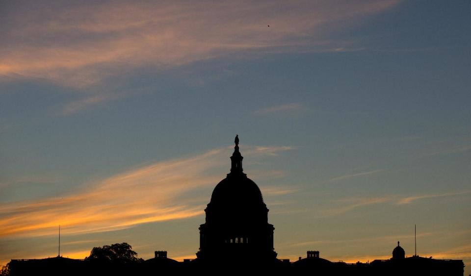 FILE - In this Sept. 15, 2013, file photo, the U.S. Capitol dome is silhouetted by the sunrise. The latest Associated Press-GfK poll holds some ominous signs for congressional Democrats going into the November elections. Overall, people are split between preferring Republicans or Democrats to win control of Congress. (AP Photo/Carolyn Kaster, File)