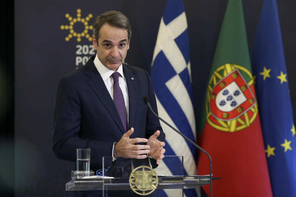 Greek Prime Minister Kyriakos Mitsotakis gestures during a joint news conference with his Portuguese counterpart Antonio Costa following their meeting at the Sao Bento palace in Lisbon, Monday, Jan. 11, 2021. (AP Photo/Pedro Rocha)