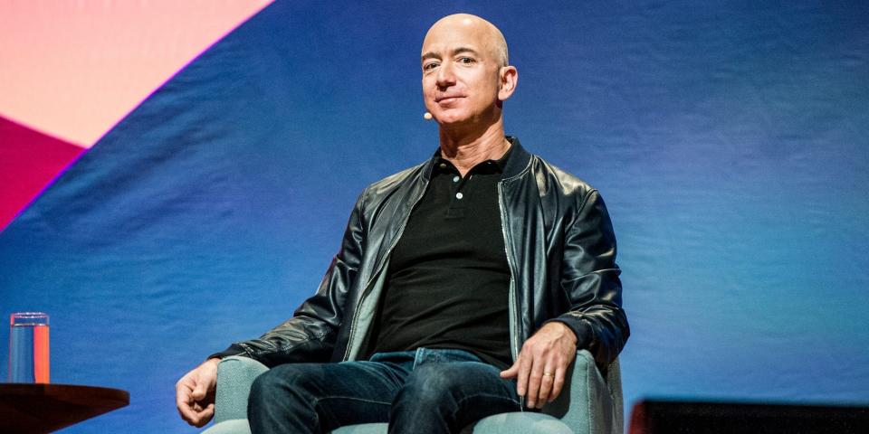 Jeff Bezos sitting on a chair.