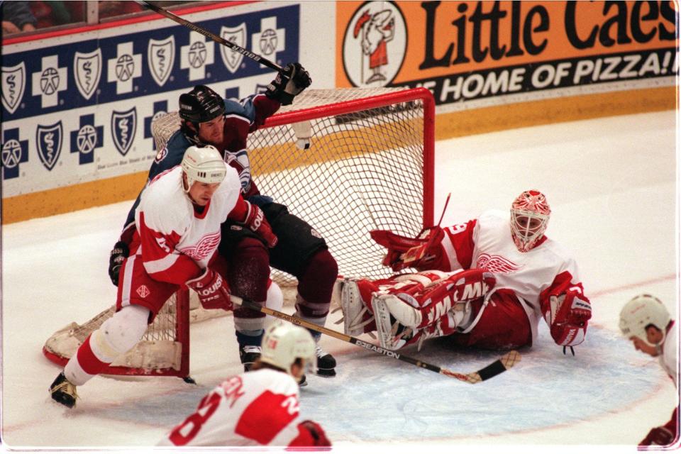 Detroit Red Wings goalie Mike Vernon and defenseman Nicklas Lidstrom (5) protect the net vs. the Colorado Avalanche in Game 3 at Joe Louis Arena in the Western Conference finals, May 19, 1997.