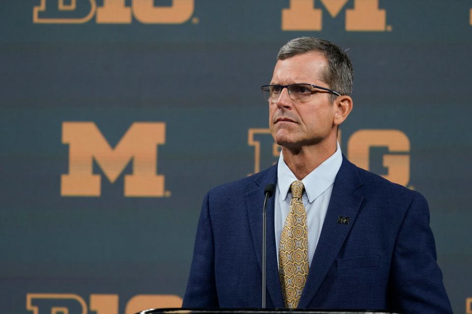 Michigan head coach Jim Harbaugh talks to reporters during an NCAA college football news conference at the Big Ten Conference media days, at Lucas Oil Stadium, Tuesday, July 26, 2022, in Indianapolis. (AP Photo/Darron Cummings)