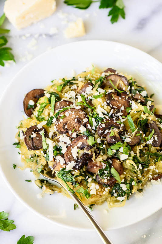 <p>Well Plated</p><p>Roasted spaghetti squash tossed with Parmesan, garlic, spinach and mushrooms. Perfect for a quick, healthy dinner. Vegetarian and gluten free.</p><p><a href="http://www.wellplated.com/roasted-spaghetti-squash-parmesan-mushrooms/" rel="nofollow noopener" target="_blank" data-ylk="slk:Get the recipe here!;elm:context_link;itc:0;sec:content-canvas" class="link rapid-noclick-resp"><em><strong>Get the recipe here!</strong></em></a></p>