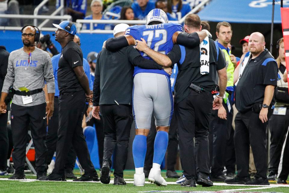 Detroit Lions guard Halapoulivaati Vaitai (72) walks off the field with the help of team staff due to an injury during the second half against Seattle Seahawks at Ford Field in Detroit on Sunday, Sept. 17, 2023.