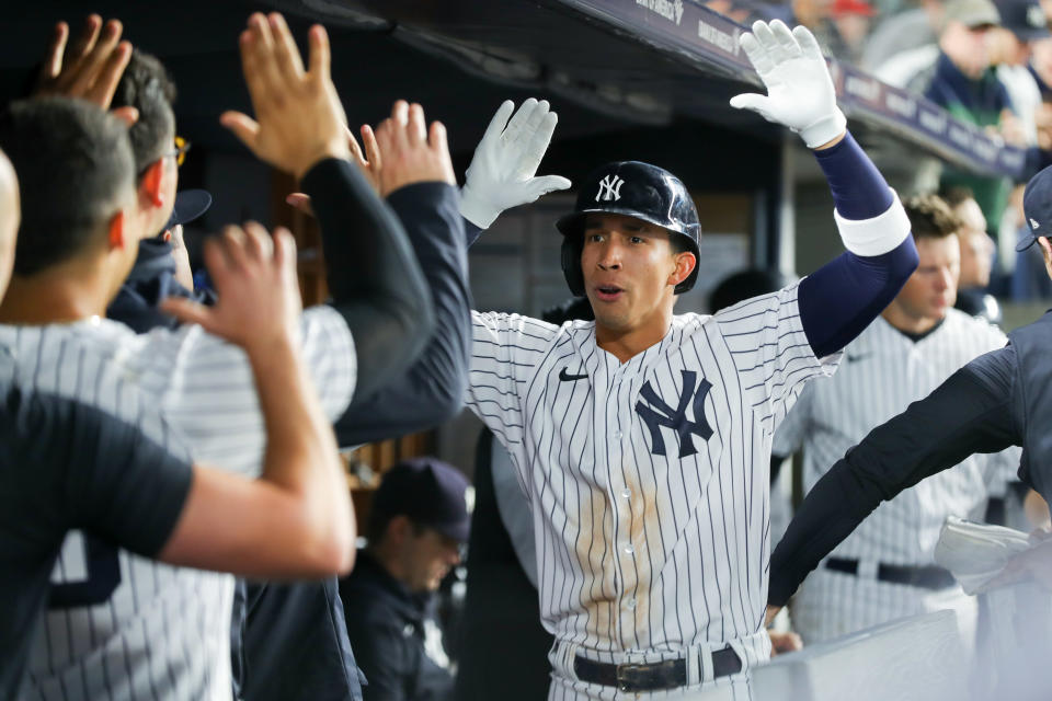 NEW YORK, NY - SEPTEMBER 30:   Oswaldo Cabrera #95 of the New York Yankees high-fives teammates in the dugout after hitting a home run in the fifth inning during the game between the Baltimore Orioles and the New York Yankees at Yankee Stadium on Friday, September 30, 2022 in New York, New York. (Photo by Mary DeCicco/MLB Photos via Getty Images)