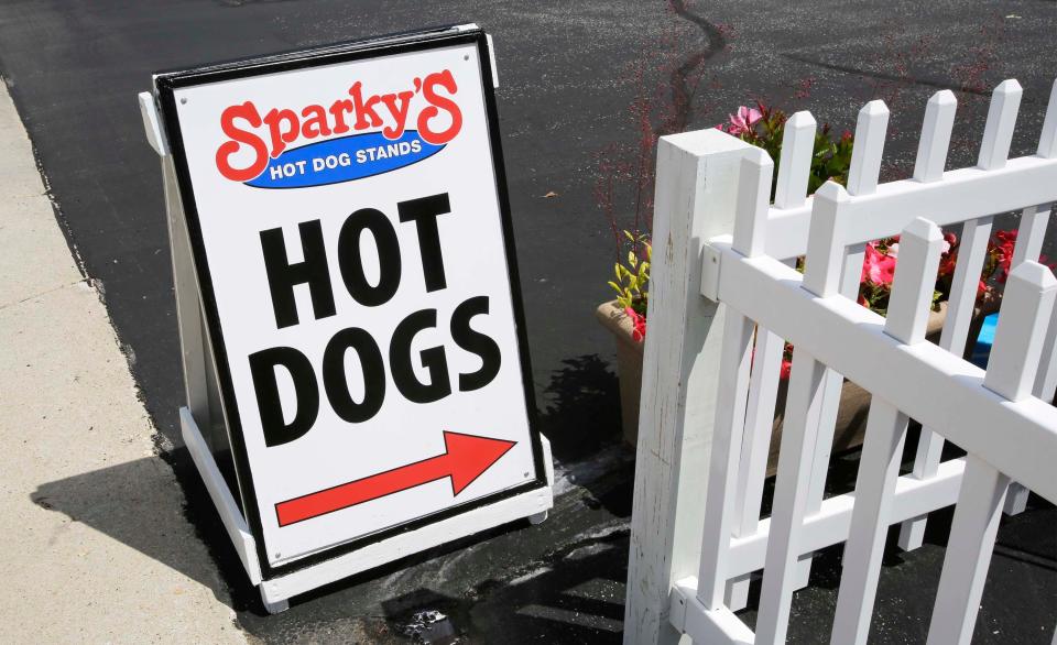 A sign directs customers at Sparky's hot dog stand along the 800 block of South 8th St., Tuesday, July 12, 2022, in Sheboygan, Wis.