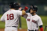 Boston Red Sox's Mitch Moreland (18) celebrates his two-run home run with Alex Verdugo during the third inning of a baseball game against the Toronto Blue Jays, Friday, Aug. 7, 2020, in Boston. (AP Photo/Michael Dwyer)