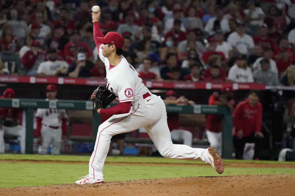 Los Angeles Angels starting pitcher Shohei Ohtani throws to a Toronto Blue Jays batter during the fourth inning of a baseball game Thursday, Aug. 12, 2021, in Anaheim, Calif. (AP Photo/Marcio Jose Sanchez)
