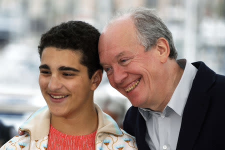 72nd Cannes Film Festival - Photocall for the film "Le jeune Ahmed" (Young Ahmed) in competition - Cannes, France, May 21, 2019. Director Luc Dardenne and cast member Idir Ben Addi pose. REUTERS/Eric Gaillard