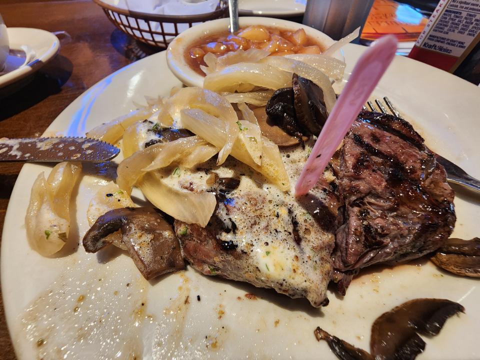 Logan's Roadhouse steak with onions