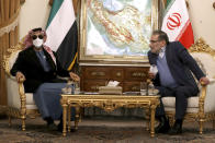 FILE - Secretary of Iran's Supreme National Security Council Ali Shamkhani, right, speaks with United Arab Emirates' top national security adviser Sheikh Tahnoon bin Zayed Al Nahyan during their meeting in Tehran, Iran, Monday, Dec. 6, 2021. After years of looking abroad, mainly to the West, for answers to regional problems, Middle East countries now appear to instead be turning inward, talking to each other about resolving long-running tensions and issues. (AP Photo/Vahid Salemi, File)