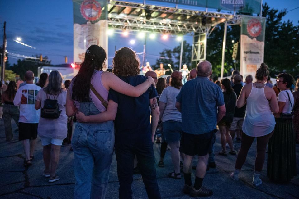 People attend one of the concerts of the 2023 Rhythm and Brews held in downtown Hendersonville.