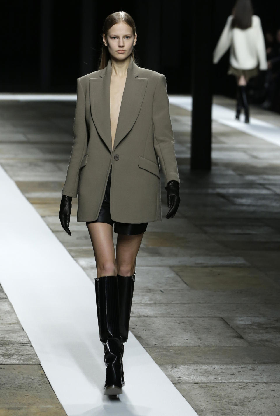 A model walks the runway during the Theyskens Theory Fall 2013 runway show at Fashion Week in New York, Monday, Feb. 11, 2013. (AP Photo/Kathy Willens)