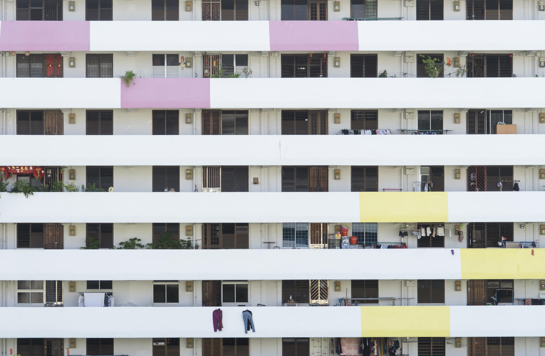 Units in a public Housing Development Board (HDB) block of flats in MacPherson estate, Singapore with windows closed