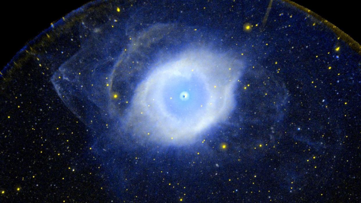  a cloud of blue-white gas in space 