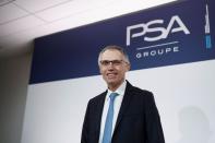 Carlos Tavares, chief executive officer of PSA Group, poses for a photograph before the annual results news conference at their headquarters in Rueil-Malmaison, near Paris