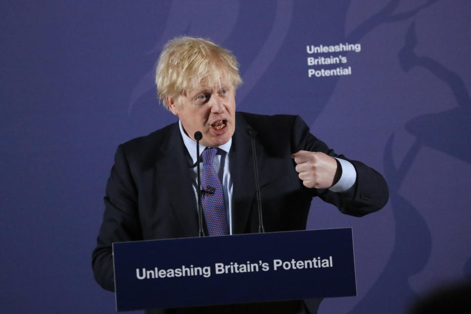 British Prime Minister Boris Johnson outlines his government's negotiating stance with the European Union after Brexit, during a key speech at the Old Naval College in Greenwich, London, Monday, Feb. 3, 2020. (AP Photo/Frank Augstein, Pool)