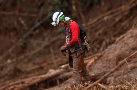 A rescue worker reacts as he attends a mass for victims of a collapsed tailings dam owned by Brazilian mining company Vale SA, in Brumadinho, Brazil February 1, 2019. REUTERS/Adriano Machado