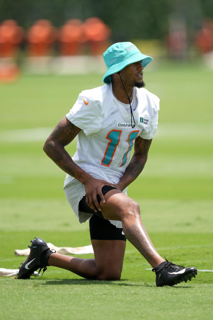 Miami Dolphins wide receiver Cedrick Wilson Jr. (11) stretches prior to OTA practice at Baptist Health Training Complex.